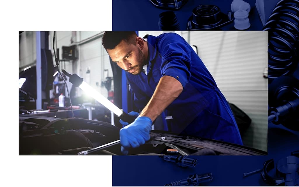 Nalley technician working under the hood with genuine OEM tools