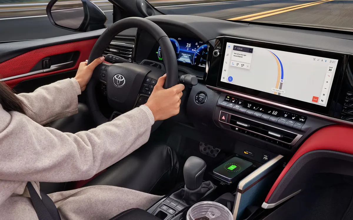 2027 Toyota Camry interior with digital gauge cluster, touchscreen navigation and wireless charger
